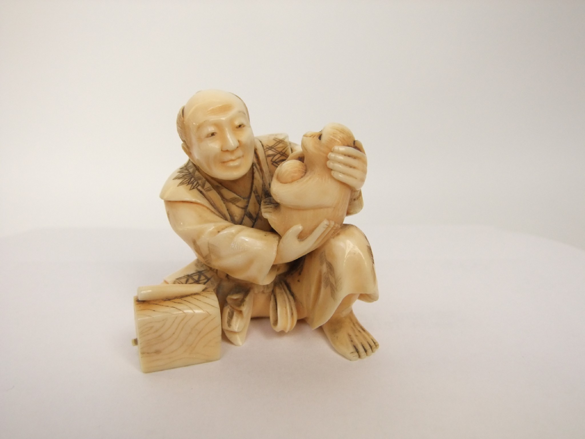 Appraisal: A late th early th century Japanese carved ivory figure