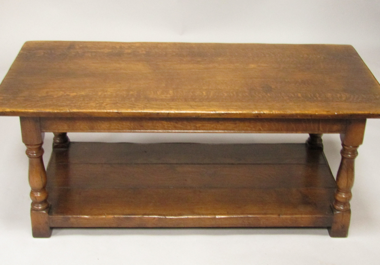 Appraisal: An oak coffee table raised on baluster turned supports and