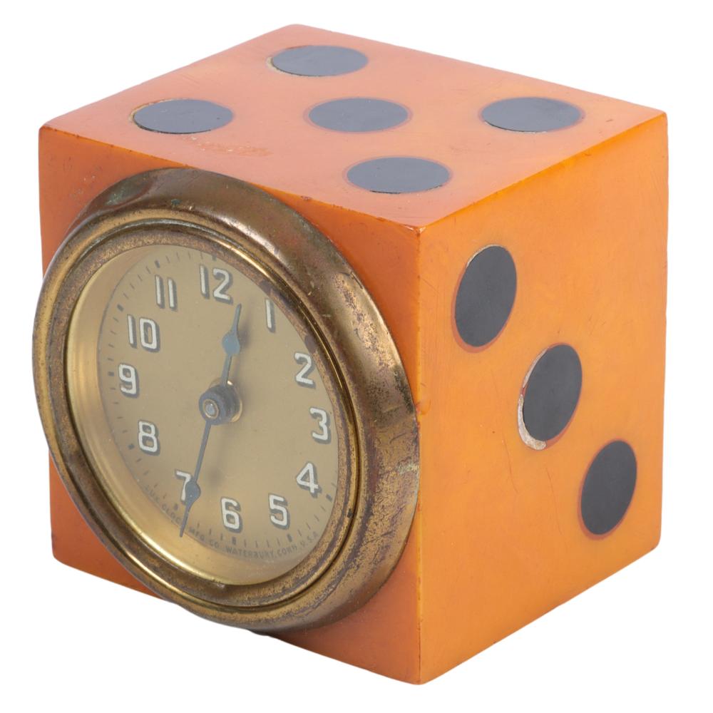 Appraisal: GEOMETRIC ORANGE BAKELITE DICE CLOCK WITH BLACK INLAID DOTS H