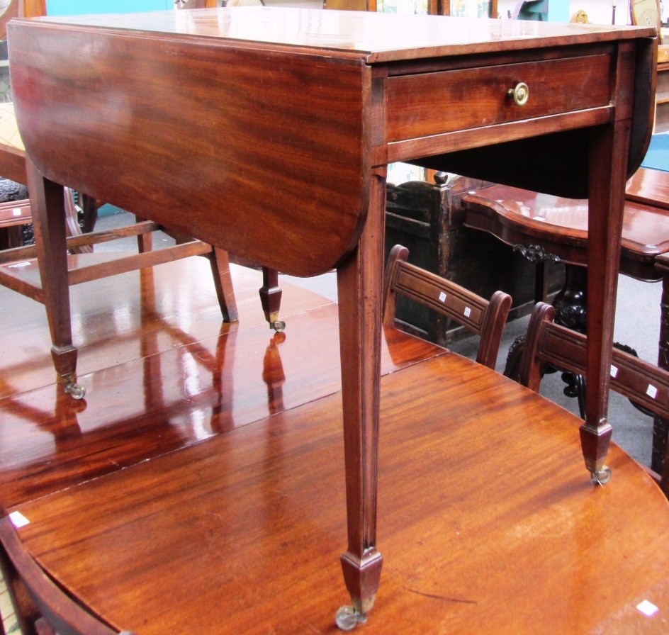 Appraisal: A George III mahogany Pembroke table with single frieze drawer