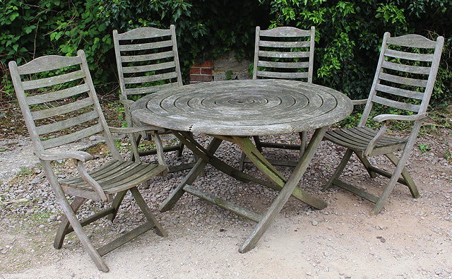 Appraisal: AN OLD TEAK SLATTED ROUND GARDEN TABLE cm diameter and