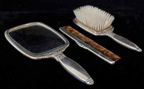 Appraisal: AMERICAN SILVER THREE PIECE DRESSER SET including a hand mirror