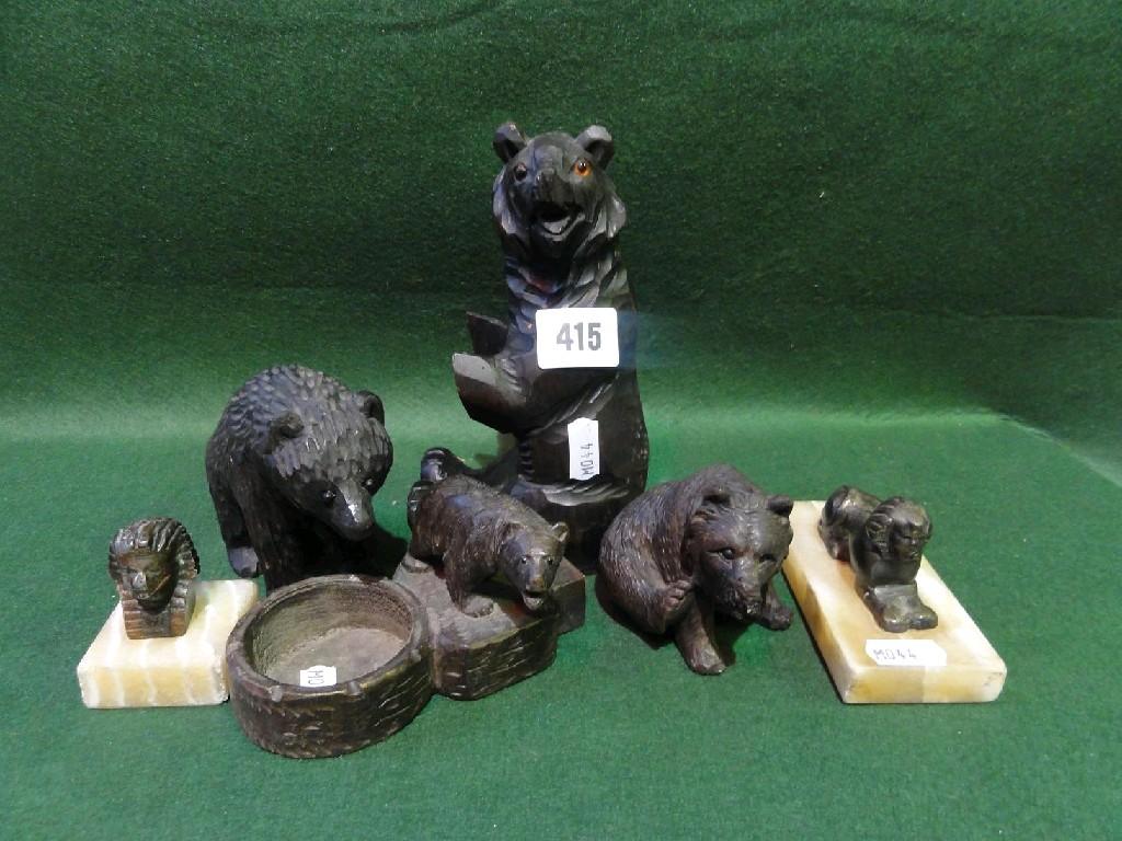 Appraisal: A collection of four Black Forest style wooden bears together