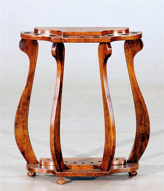 Appraisal: Walnut cane stand mid th century bowed front top with