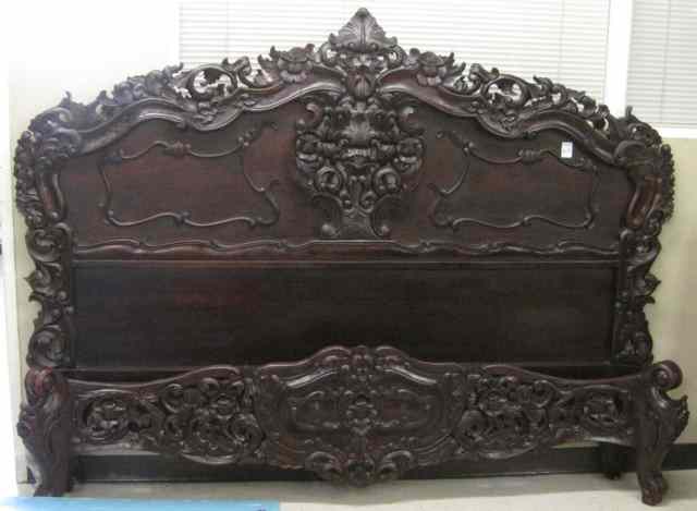 Appraisal: HIGHLY CARVED MAHOGANY KING BED WITH RAILS having a large