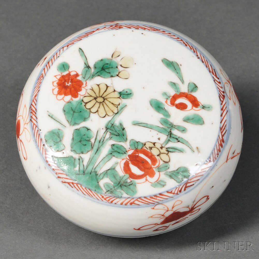 Appraisal: Wucai Covered Box China Qing Dynasty the flattened circular covered