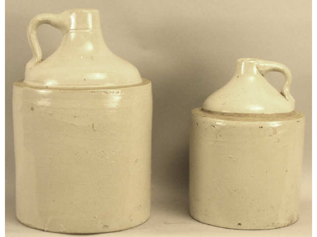 Appraisal: Collection of white crock antique whiskey jugs Estimate -