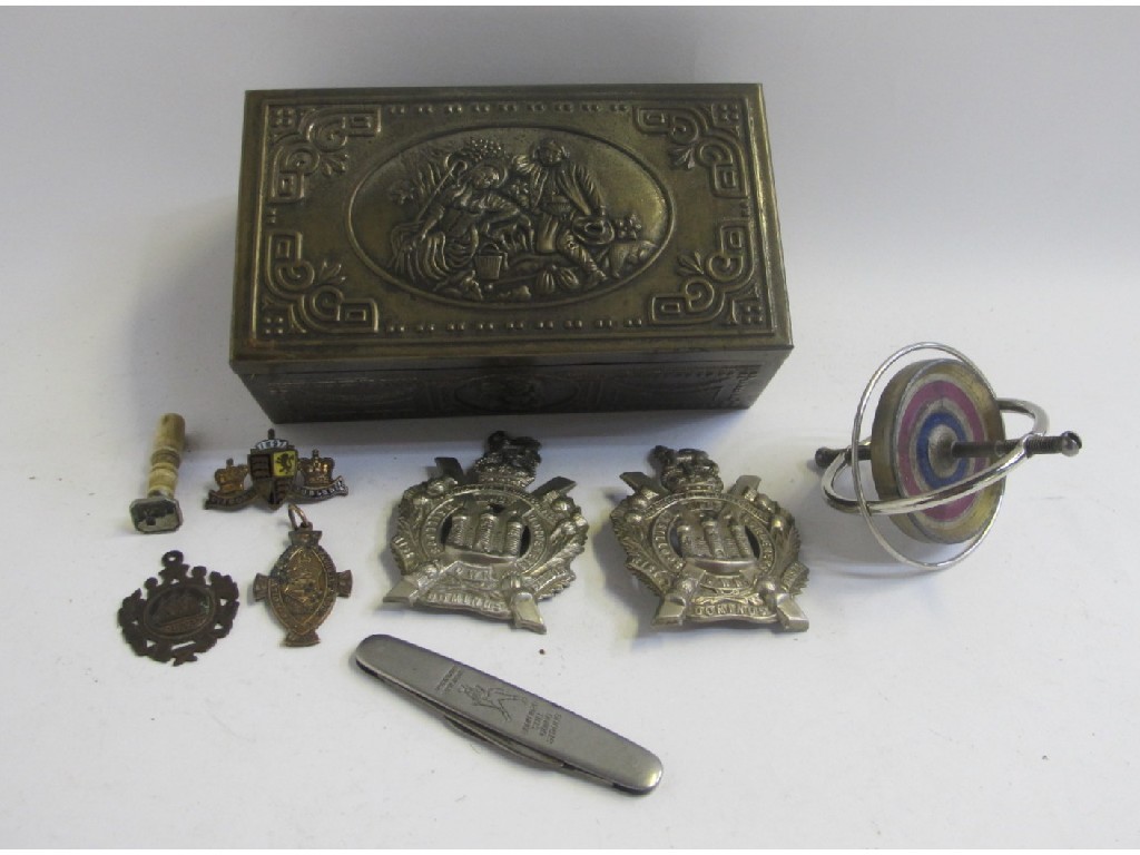 Appraisal: Lot comprising military badges a pocket knife and a gyroscope