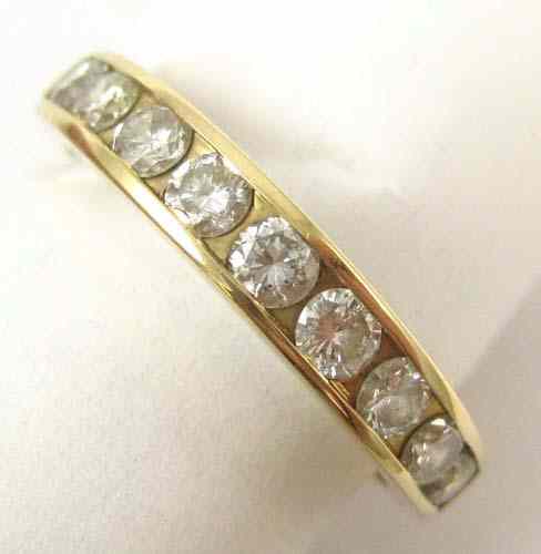 Appraisal: DIAMOND AND FOURTEEN KARAT GOLD RING set with nine round-cut