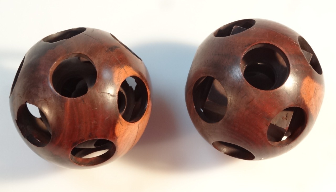 Appraisal: Two early thC rosewood puzzle balls each of orb outline