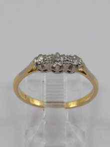 Appraisal: A yellow metal tests ct gold three stone diamond ring