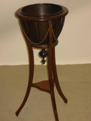 Appraisal: AN EDWARDIAN MAHOGANY JARDINIERE of circular tapering form with brass