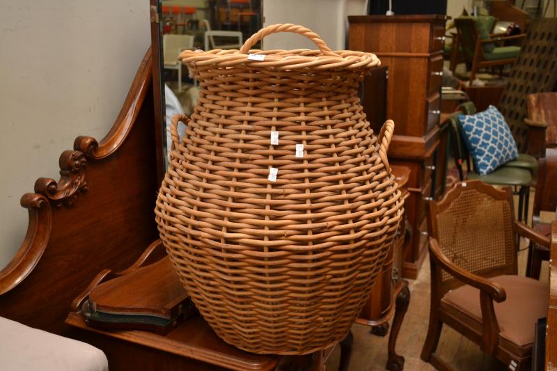 Appraisal: A CANE LAUNDRY BASKET A CANE LAUNDRY BASKET