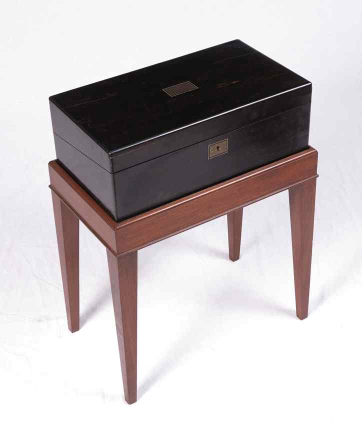 Appraisal: EBONIZED LAP DESK ON STAND Fitted interior with red writing