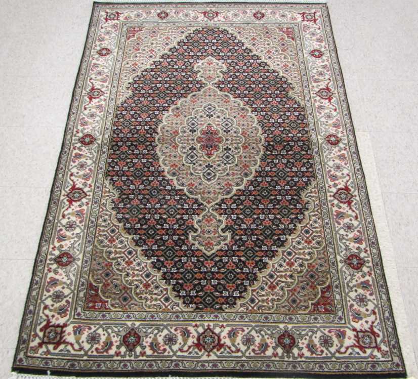 Appraisal: HAND KNOTTED ORIENTAL AREA RUG Indo-Bijar central medallion and overall