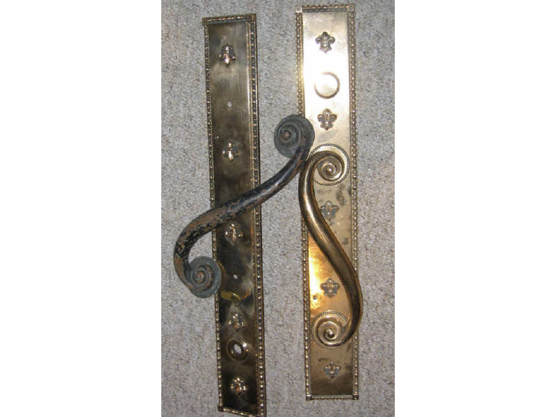 Appraisal: PAIR OF AMERICAN CAST BRASS DOOR HANDLES the rectangular plates