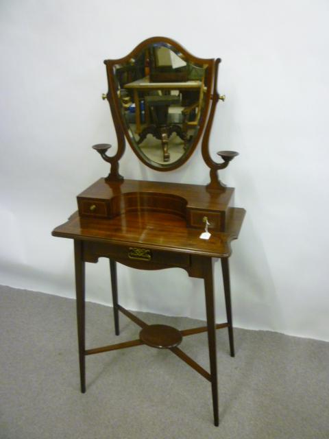 Appraisal: A GENTLEMAN'S LATE VICTORIAN MAHOGANY SHAVING STAND of shaped oblong