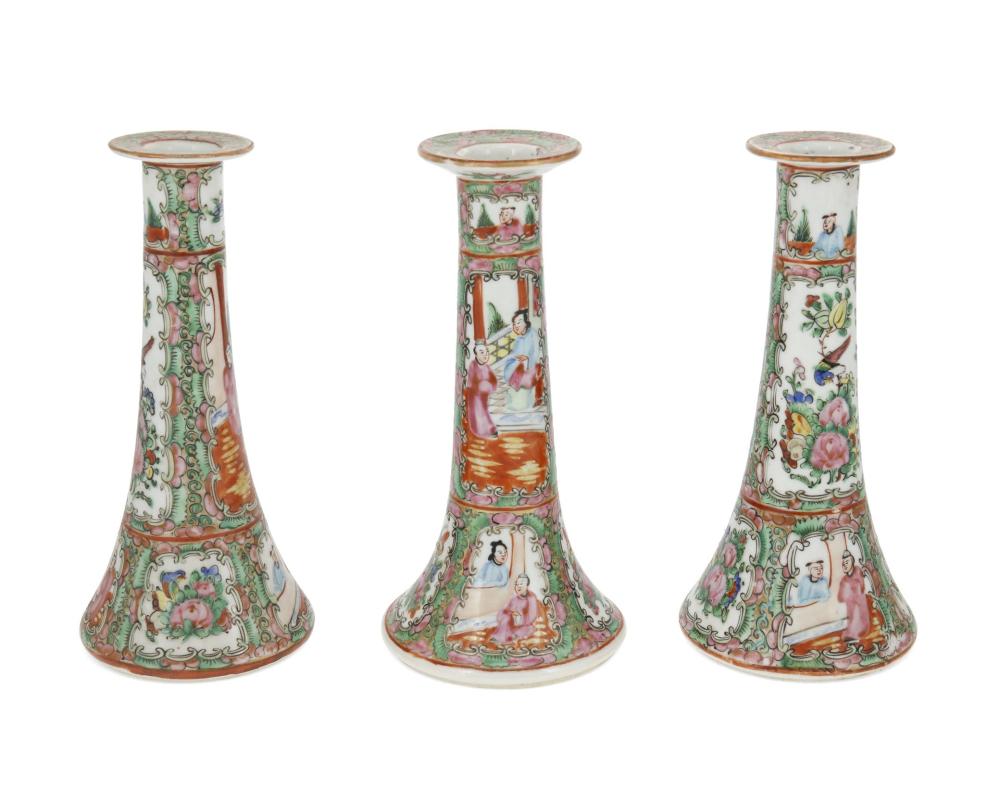 Appraisal: THREE CHINESE ROSE MEDALLION PORCELAIN CANDLESTICKSThree Chinese Rose Medallion porcelain