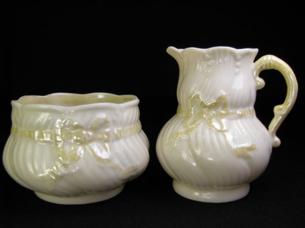 Appraisal: Bow tie pattern Creamer measures high by wide Sugar measures