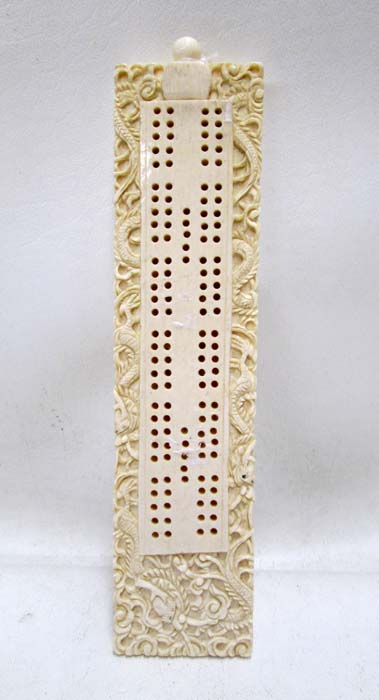 Appraisal: AN IVORY CHINESE HAND CARVED CRIBBAGE BOARD the peg holes