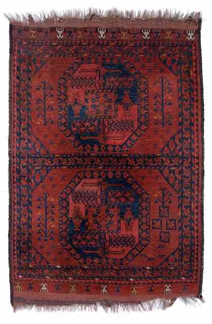 Appraisal: AN ANTIQUE ERSARI AFGHAN RUG the divided field with twin