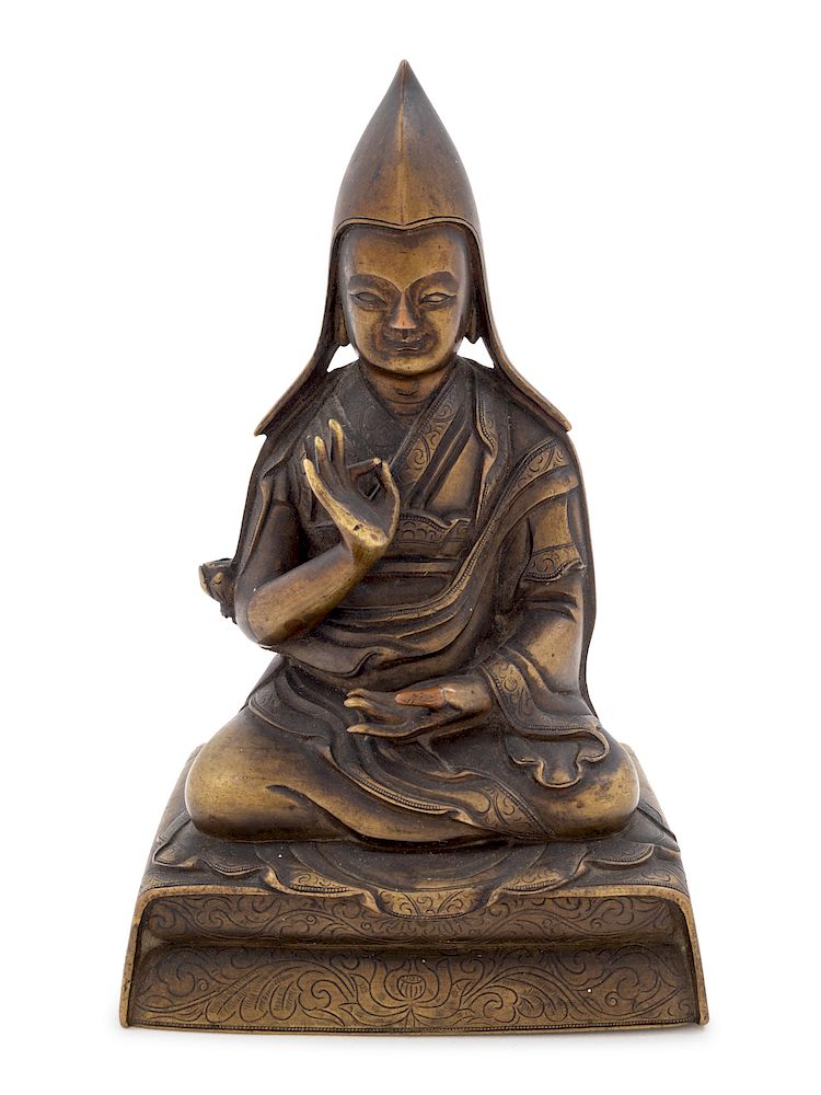 Appraisal: A Sino-Tibetan Gilt Bronze Figure of a Lama Height in