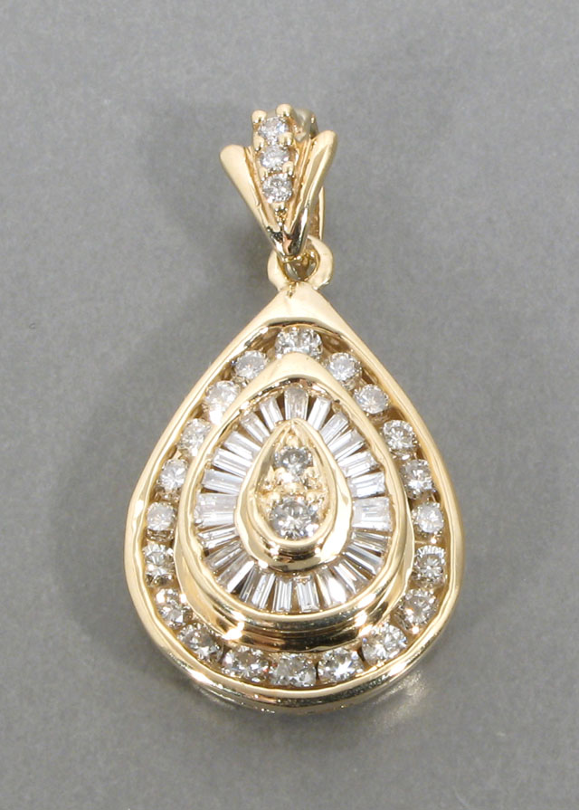 Appraisal: DIAMOND AND FOURTEEN KARAT GOLD PENDANT The pear-shaped pendant is