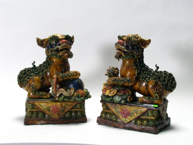 Appraisal: Pair of Oriental Foo Dog statuary glazed pottery '' high