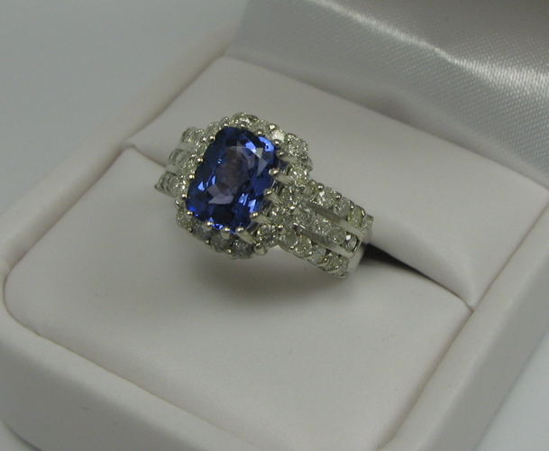 Appraisal: TANZANITE DIAMOND AND K WHITE GOLD RING with appraisal The