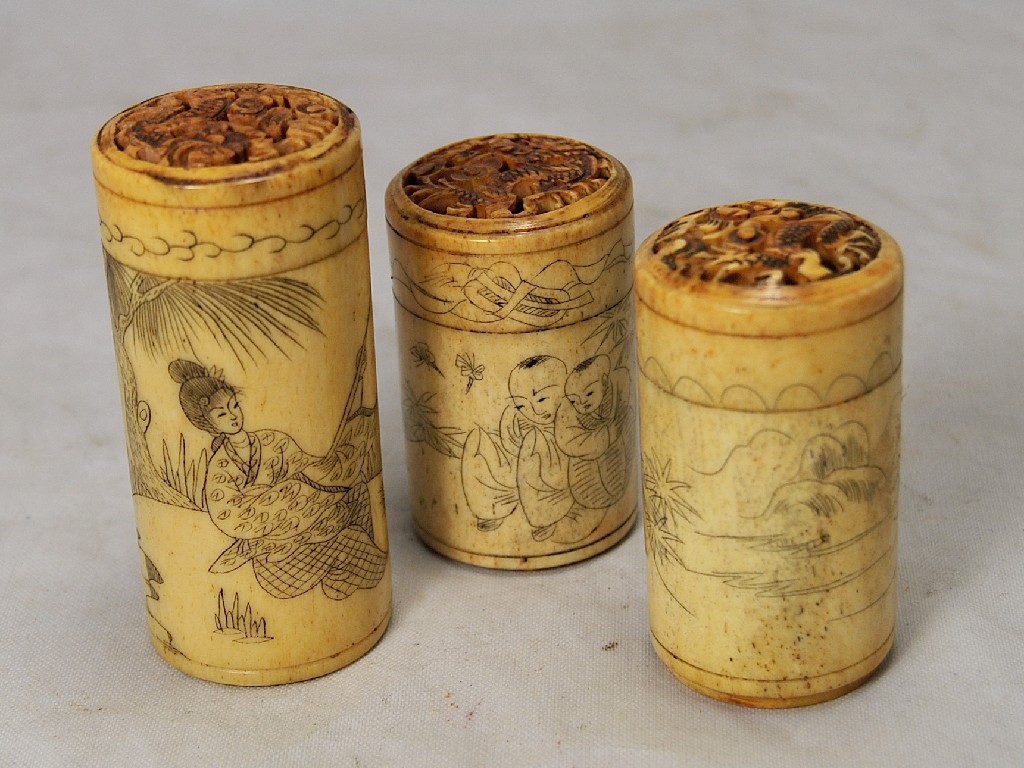 Appraisal: A graduated set of three Chinese carved bone cylindrical pots