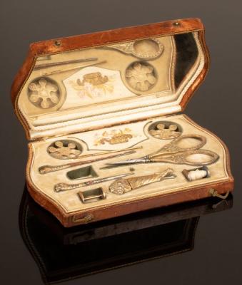 Appraisal: A Palais Royal sewing set cased in a brown leather