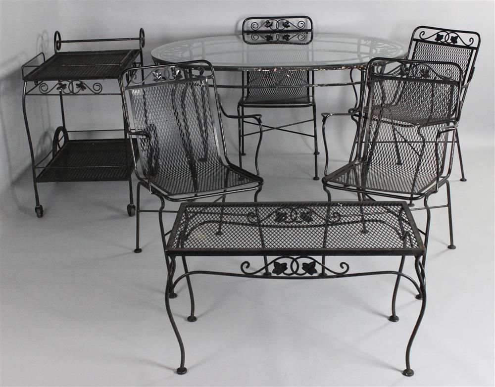 Appraisal: BLACK WROUGHT IRON GARDEN TABLE FOUR CHAIRS AND GARDEN FURNITURE