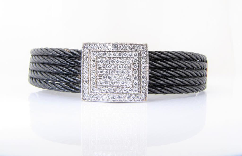 Appraisal: An K white gold and black stainless steel diamond clasp