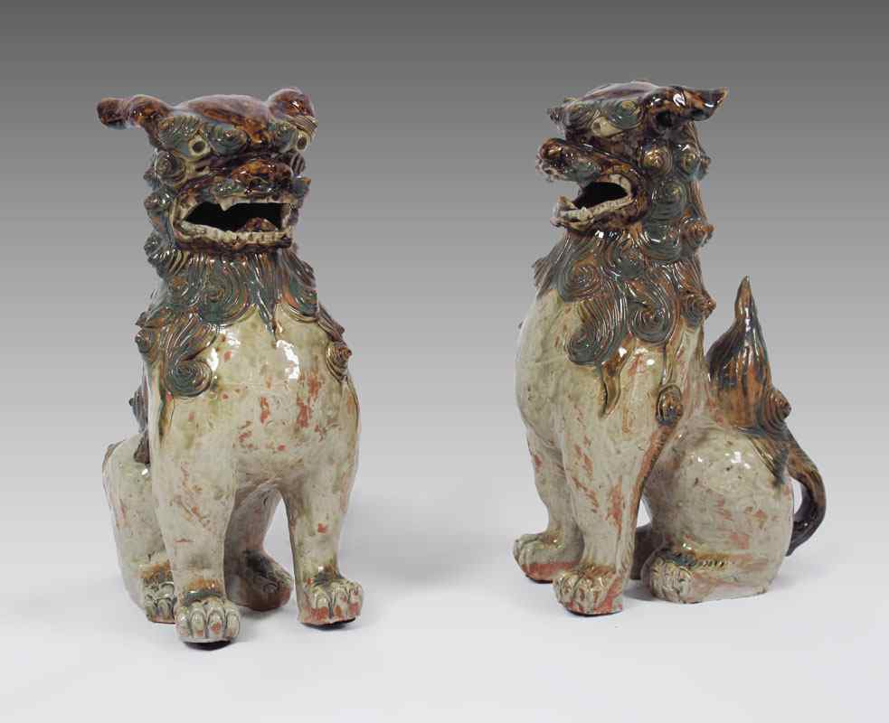 Appraisal: PAIR OF POLYCHROME POTTERY FOO DOGS '' h x ''