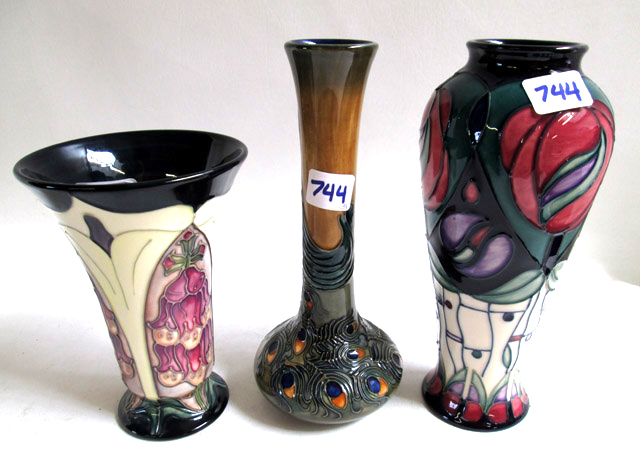 Appraisal: THREE MOORCROFT POTTERY VASES hand painted underglaze in various patterns