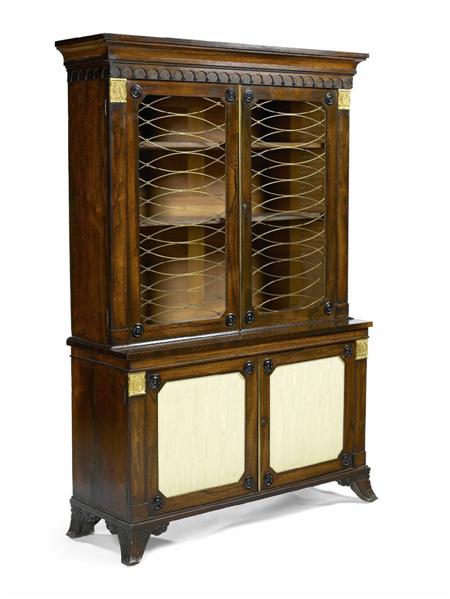 Appraisal: A Regency rosewood bookcase cabinet the projecting cornice with arcaded