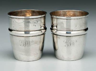 Appraisal: Pair coin silver cups round with central relief band and