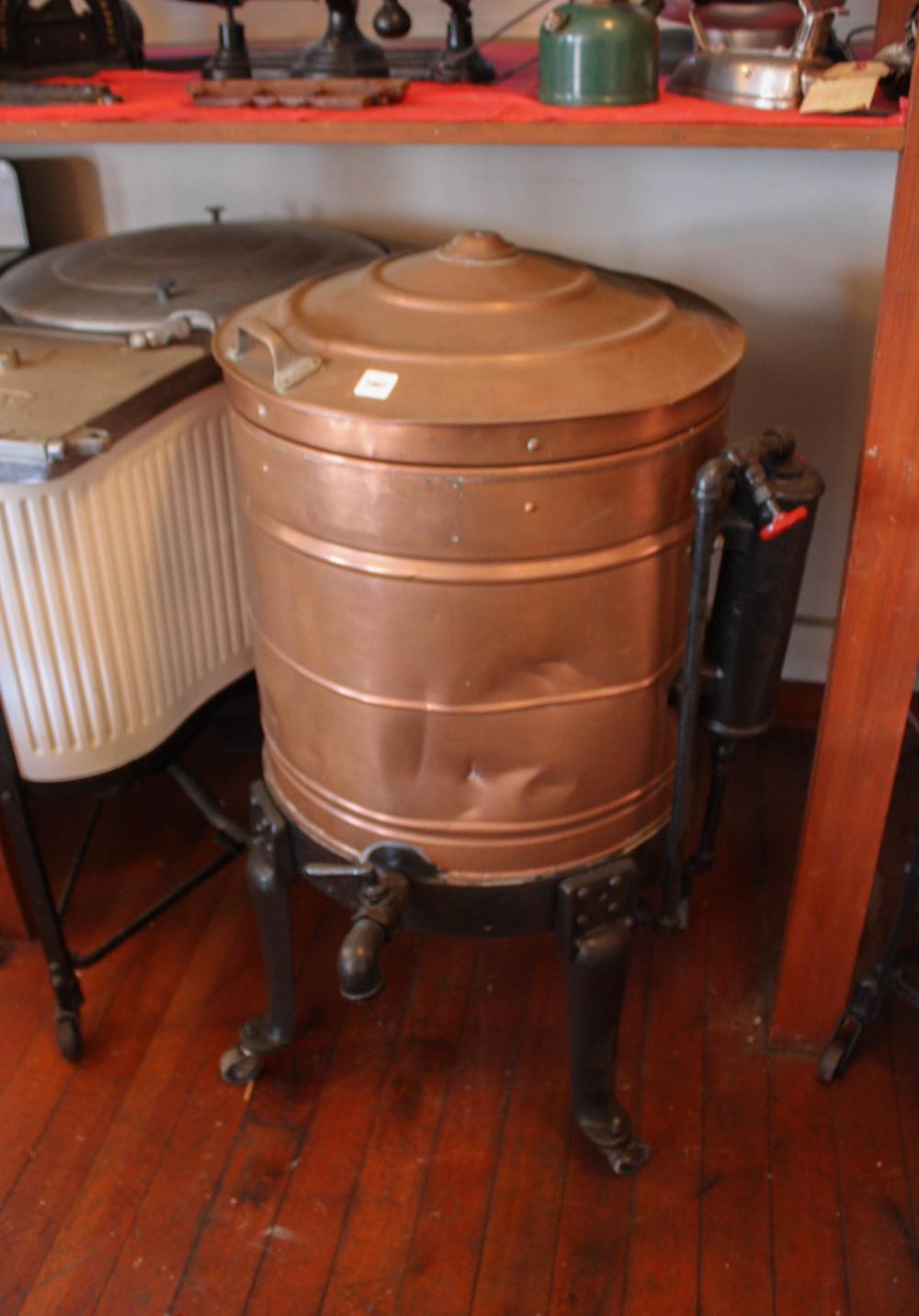 Appraisal: ANTIQUE COPPER AND CAST IRON WASH TUB WITH LID a