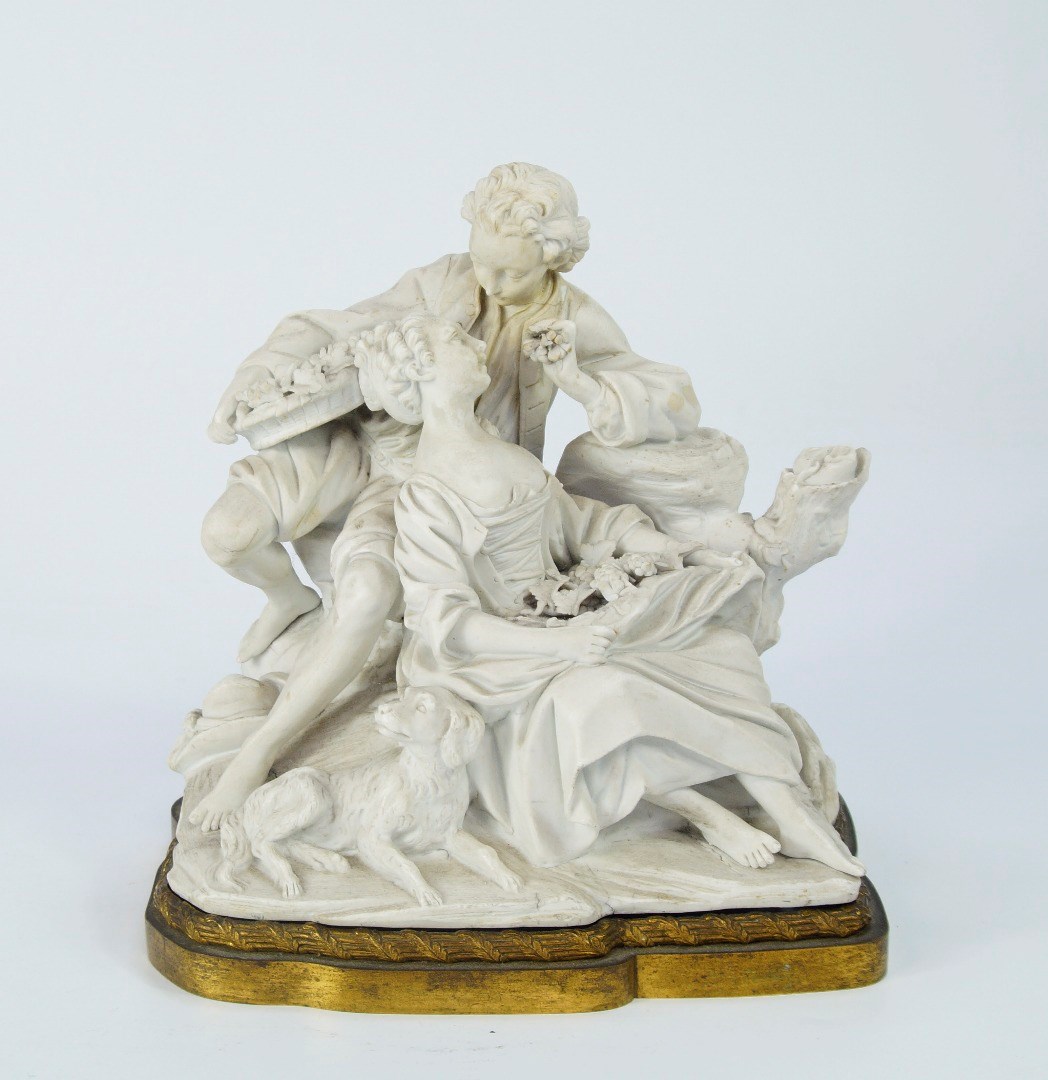 Appraisal: An thC Sevres biscuit group of two lovers eating grapes