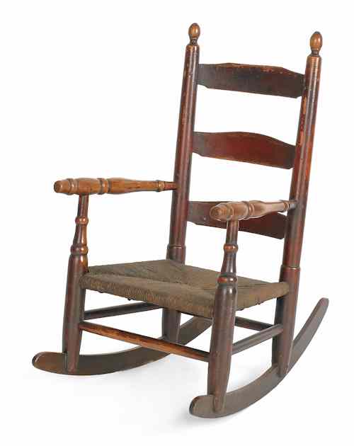 Appraisal: Child's ladderback rocking chair ca retaining its original red painted