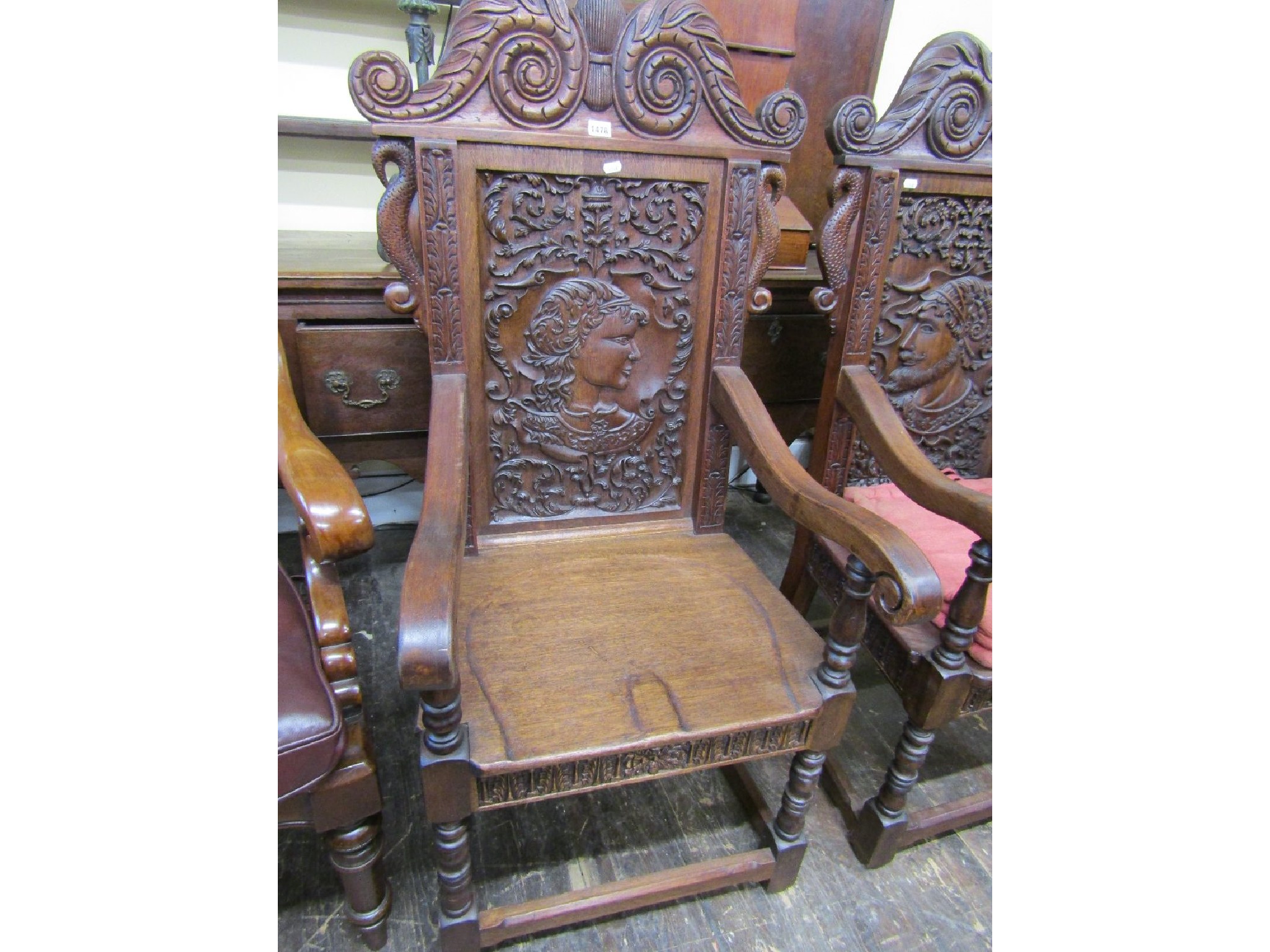 Appraisal: A pair of Old English style elbow chairs with carved