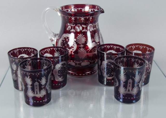 Appraisal: Bohemian-Style West German Ruby Water SetSet consists of one handled