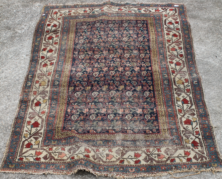 Appraisal: A rug in cream red brown and gold geometric pattern