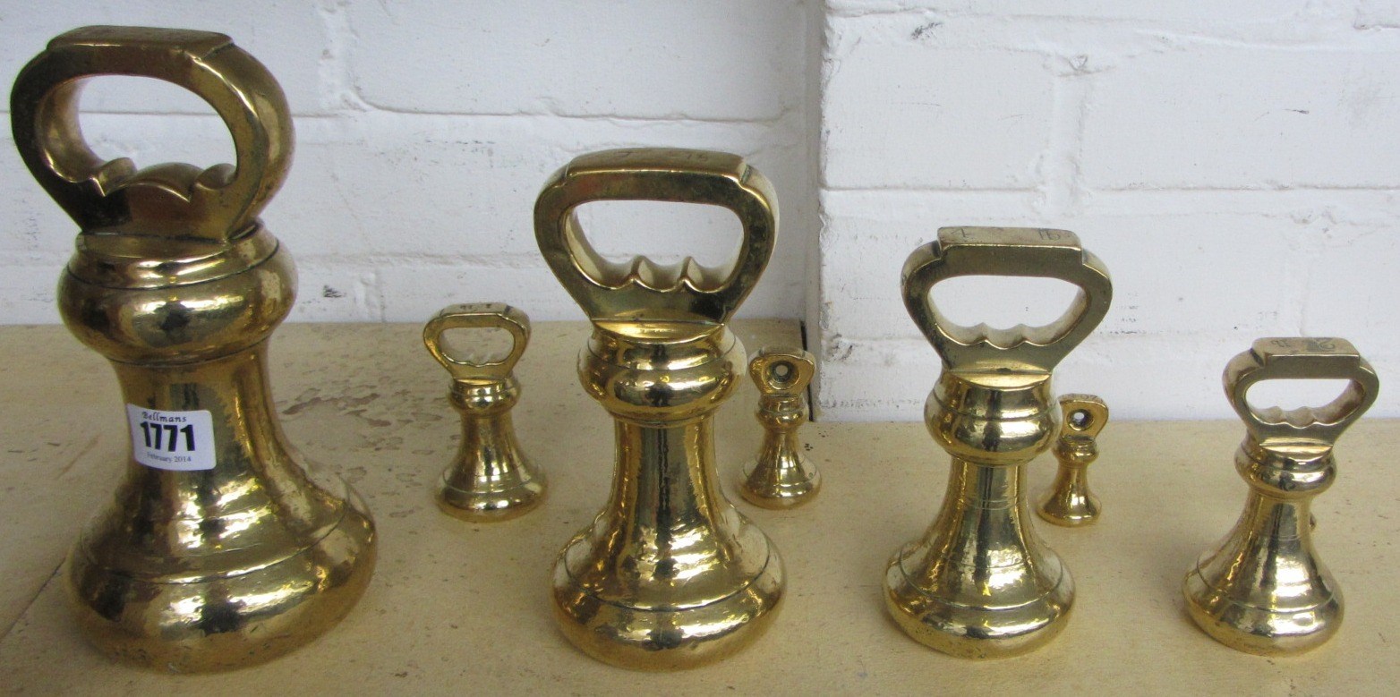 Appraisal: A set of eight Victorian brass graduated weights lbs to