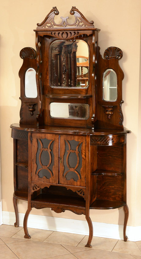 Appraisal: AESTHETIC MOVEMENT CARVED ETAGERE Oak stained with mahogany finish Top