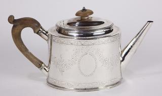 Appraisal: English George III sterling silver teapot mounted with a wood