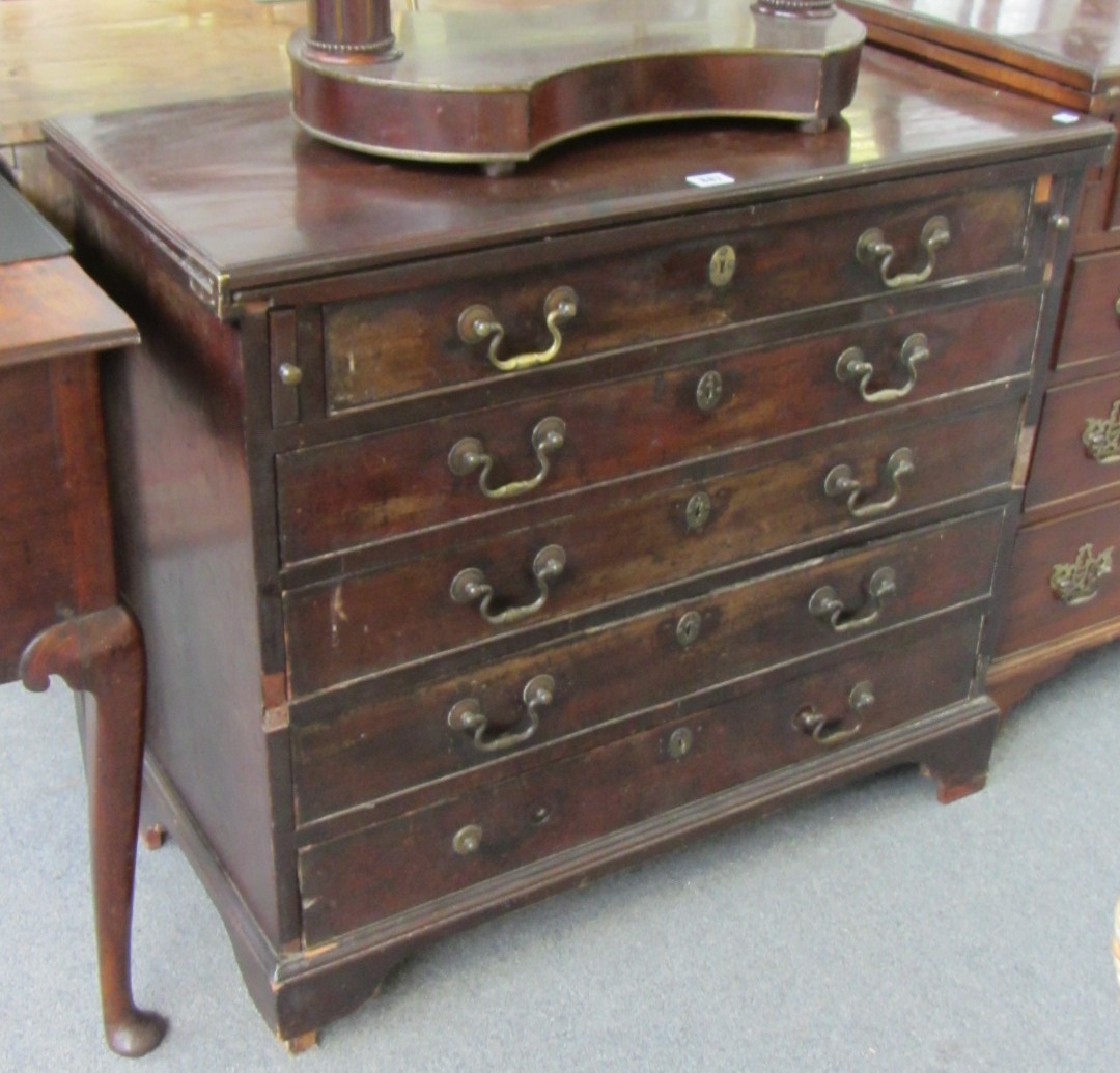 Appraisal: A mid th century mahogany batchelors chest the foldover top