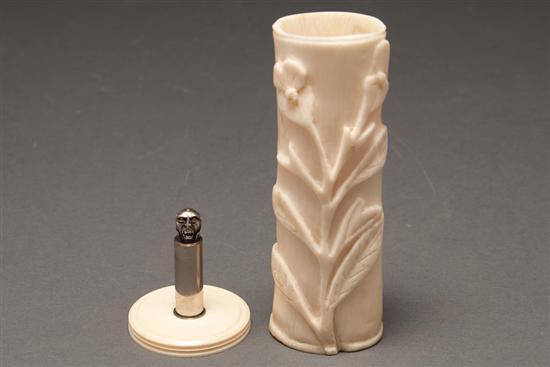 Appraisal: African carved ivory bud vase and a vampire's head-mounted nickel