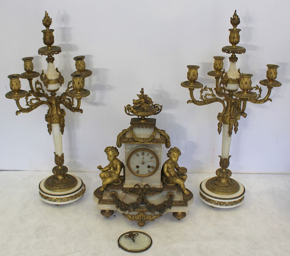 Appraisal: Fine Quality Bronze And Marble Clock Garniture Set The best