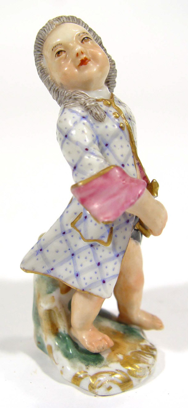 Appraisal: Continental porcelain figure of a boy in hand painted jacket